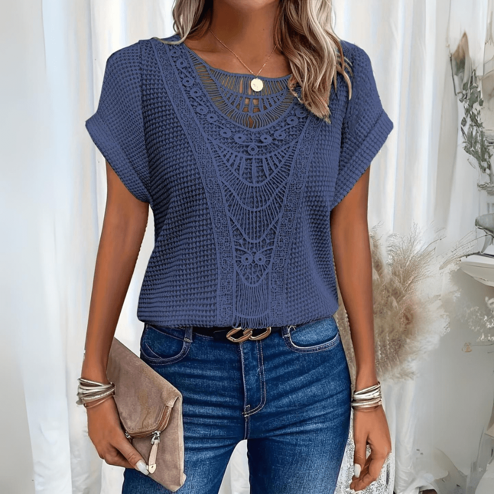 Close-up of delicate lace detail on an elegant long sleeve women's summer blouse