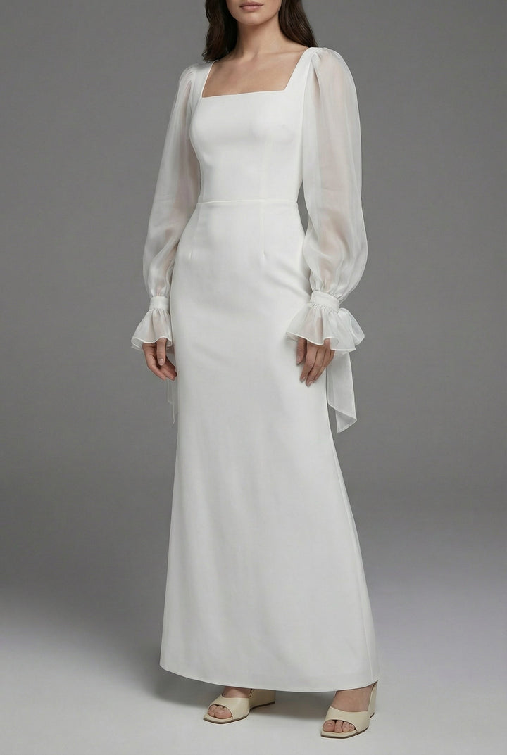 Sophisticated white minimalist maxi dress with long sleeves & square neckline for special occasion wear & formal events.