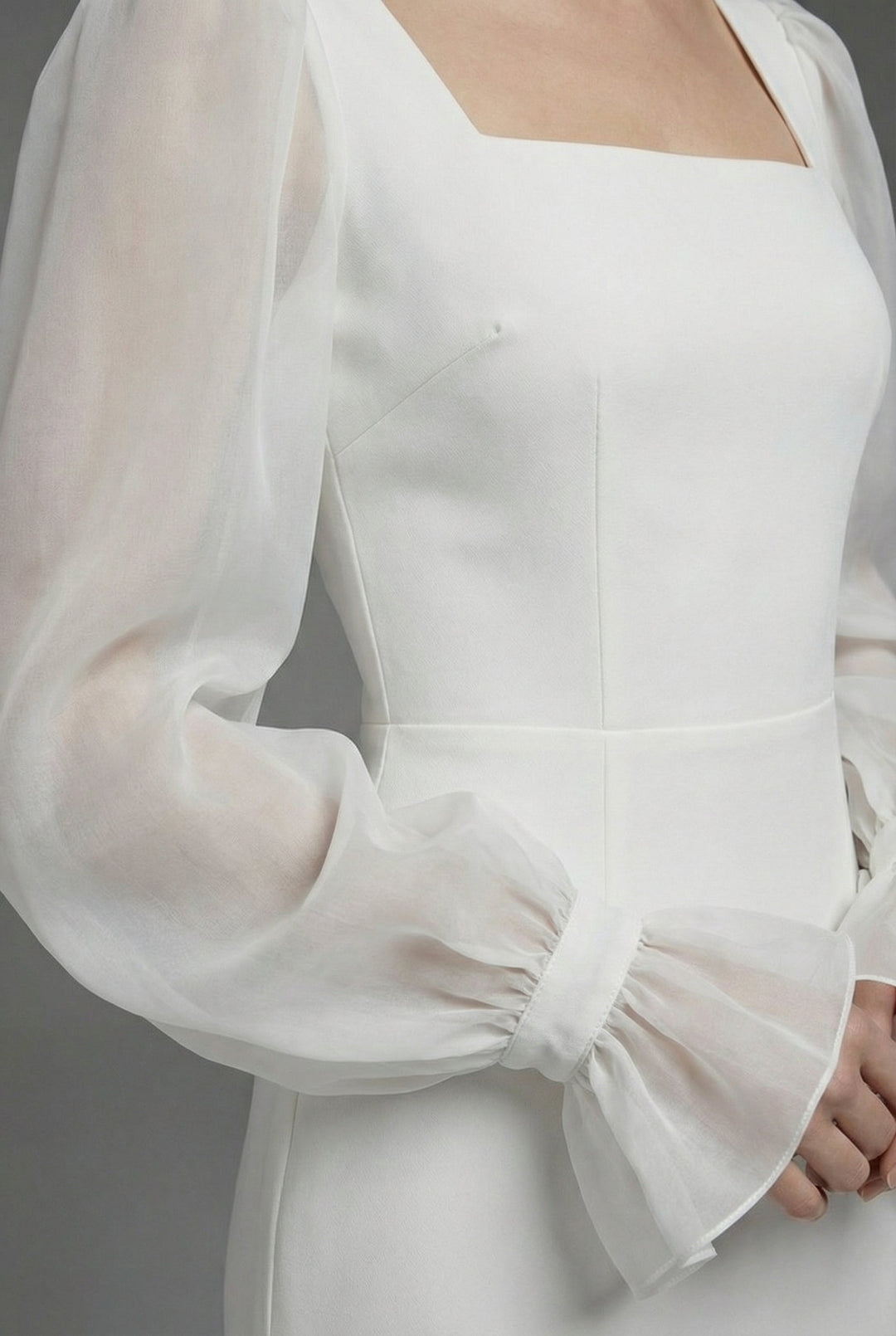 Women's white wedding guest maxi dress, an elegant formal gown with long sleeves and a stylish square neckline.