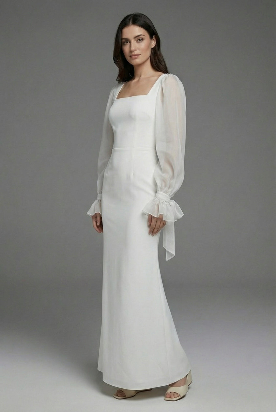 Chic white elegant maxi dress for women, ideal as a wedding guest or formal evening party dress with long sleeves.