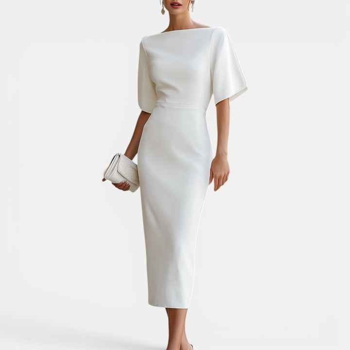 Elegant white midi dress for women, perfect for summer occasions. Sophisticated style & comfortable fit.
