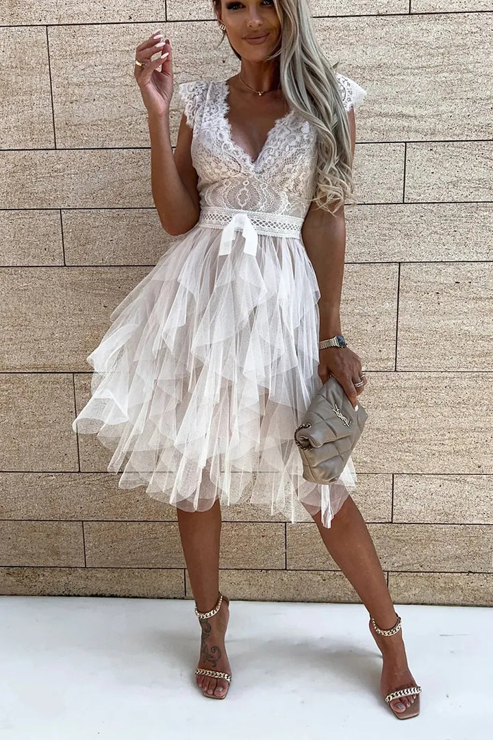 Stylish women's white ruffle cocktail mini dress for elegant evening wear.