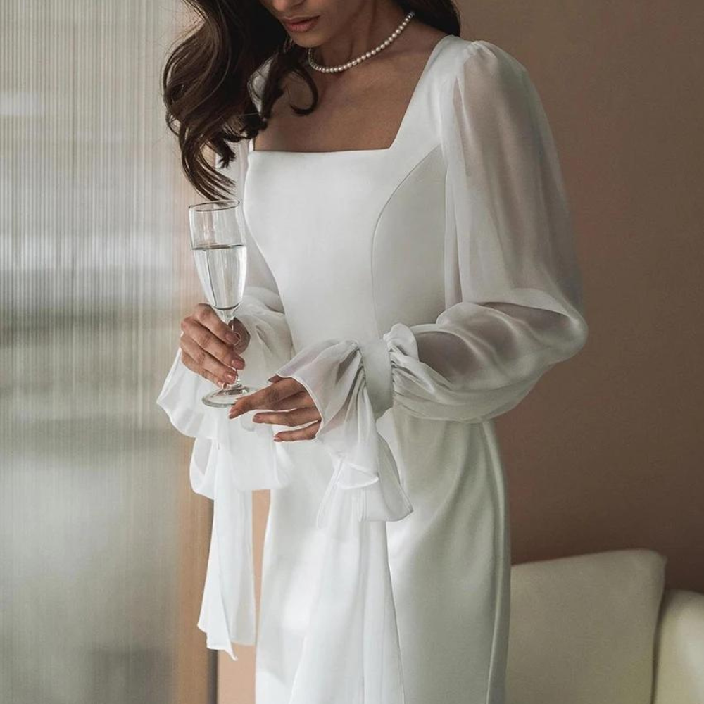 Full-length view of a women's white elegant square neck maxi dress, suitable for formal events.