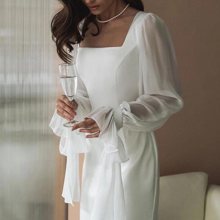 Full-length view of a women's white elegant square neck maxi dress, suitable for formal events.