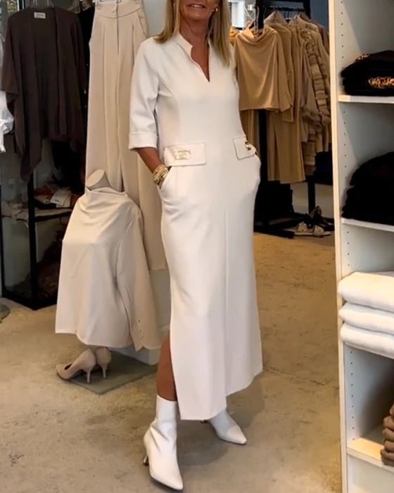 Elegant white women's dress for spring, featuring a flattering silhouette & comfortable fabric. Perfect versatile day or evening wear.