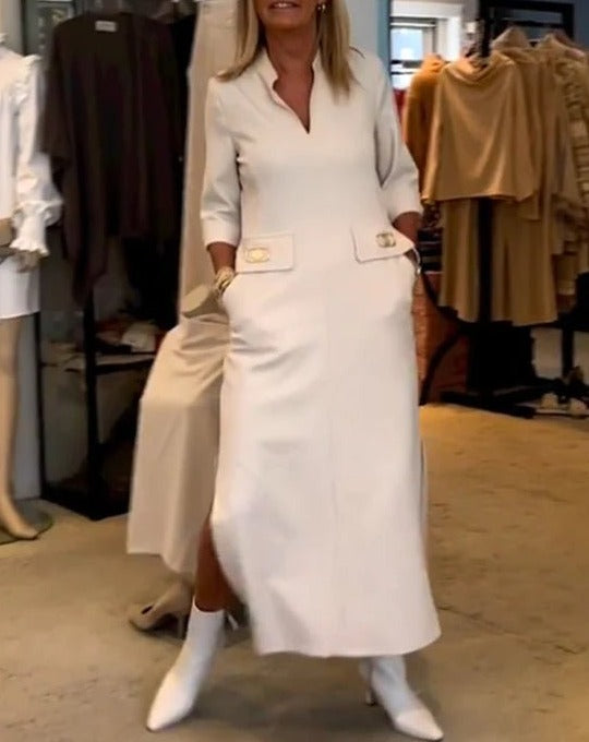 White elegant women's dress, ideal for spring fashion. Its flattering cut ensures comfort & a versatile look for any event.