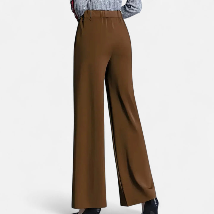 Close-up of elegant navy women's high-waist wide-leg trousers, highlighting comfortable fabric and chic design.