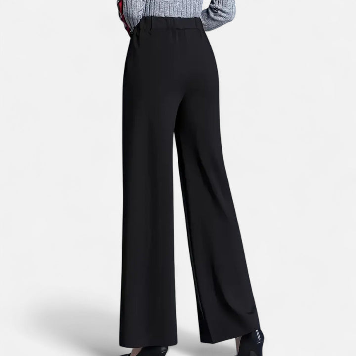 Model wearing comfortable high-waist wide-leg trousers, showcasing elegant black women's pants for versatility.