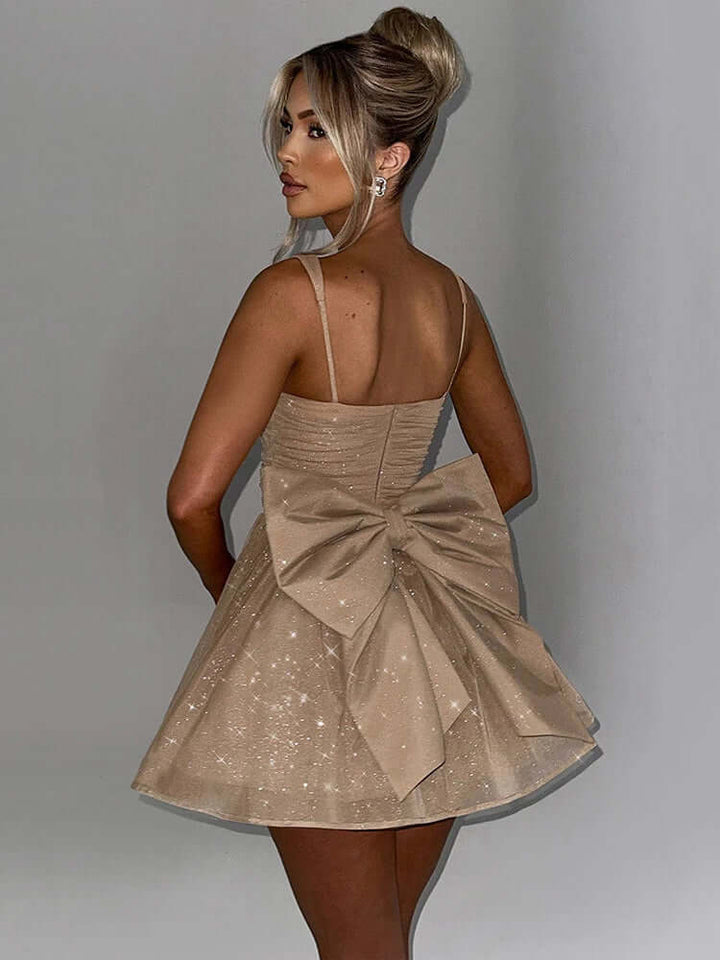 Women's sleeveless A-line midi dress featuring an elegant bow detail. Ideal for cocktail parties & evening wear.