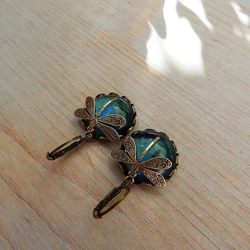 Model wearing women's antique crystal dragonfly earrings, showcasing elegant style and design.