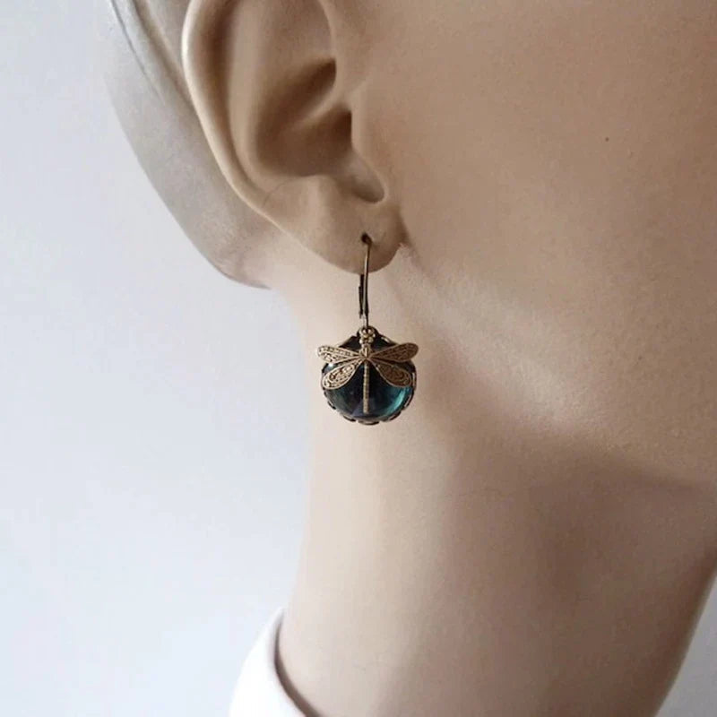 Pair of dazzling antique dragonfly earrings featuring intricate crystal detailing for women.