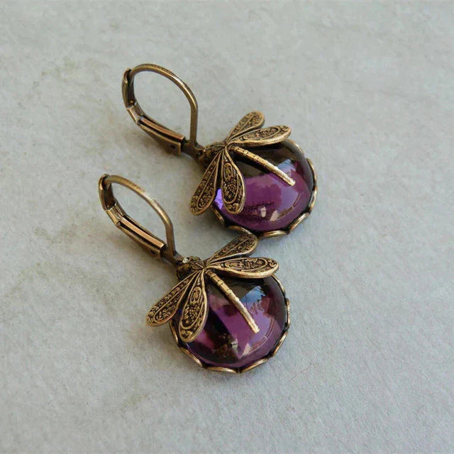 Sparkling women's antique crystal dragonfly earrings, perfect for adding sophisticated charm to evening wear.