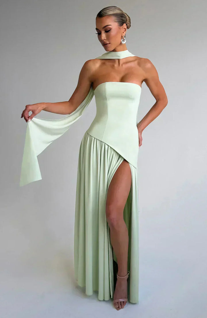 Chic women's asymmetric maxi dress, versatile for evening wear and wedding guest outfits, with a dynamic silhouette.