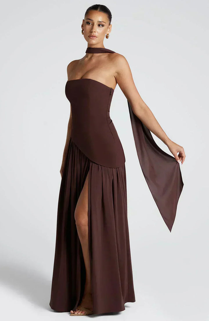 Graceful women's wedding guest dress: an asymmetric maxi style, emphasizing its flowy fabric and luxurious feel.
