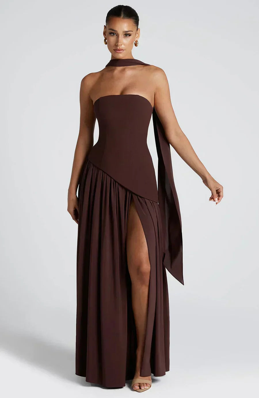 Contemporary women's evening gown: an asymmetric maxi dress that combines elegance and modern fashion sensibilities.