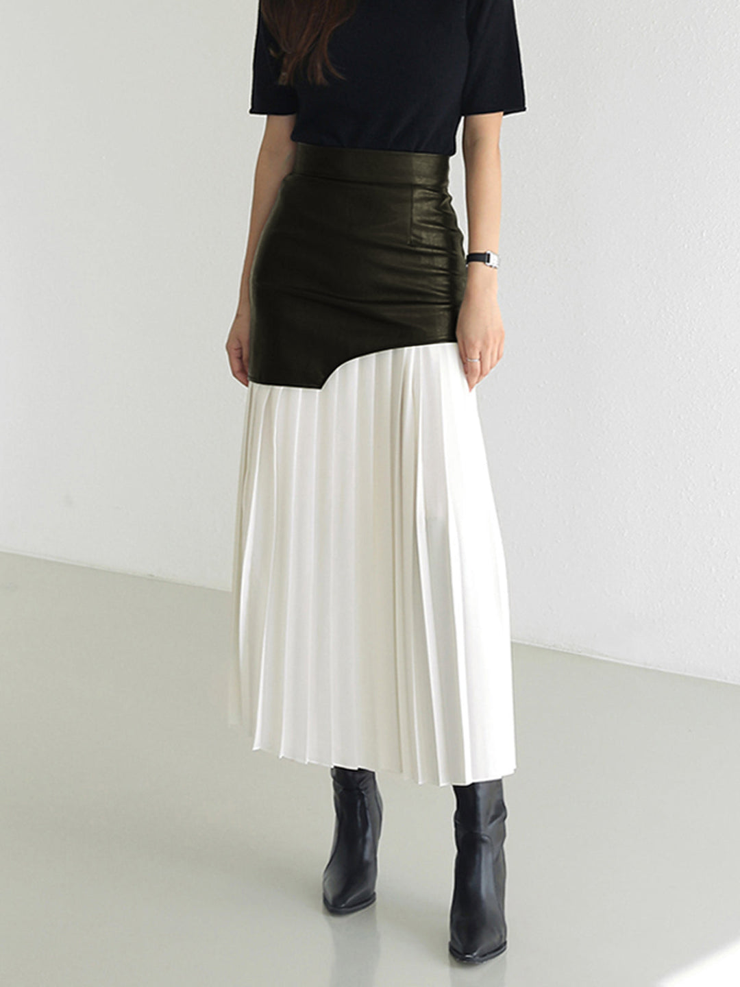 Fashionable women's asymmetrical pleated midi skirt, a comfortable yet chic addition to any wardrobe.