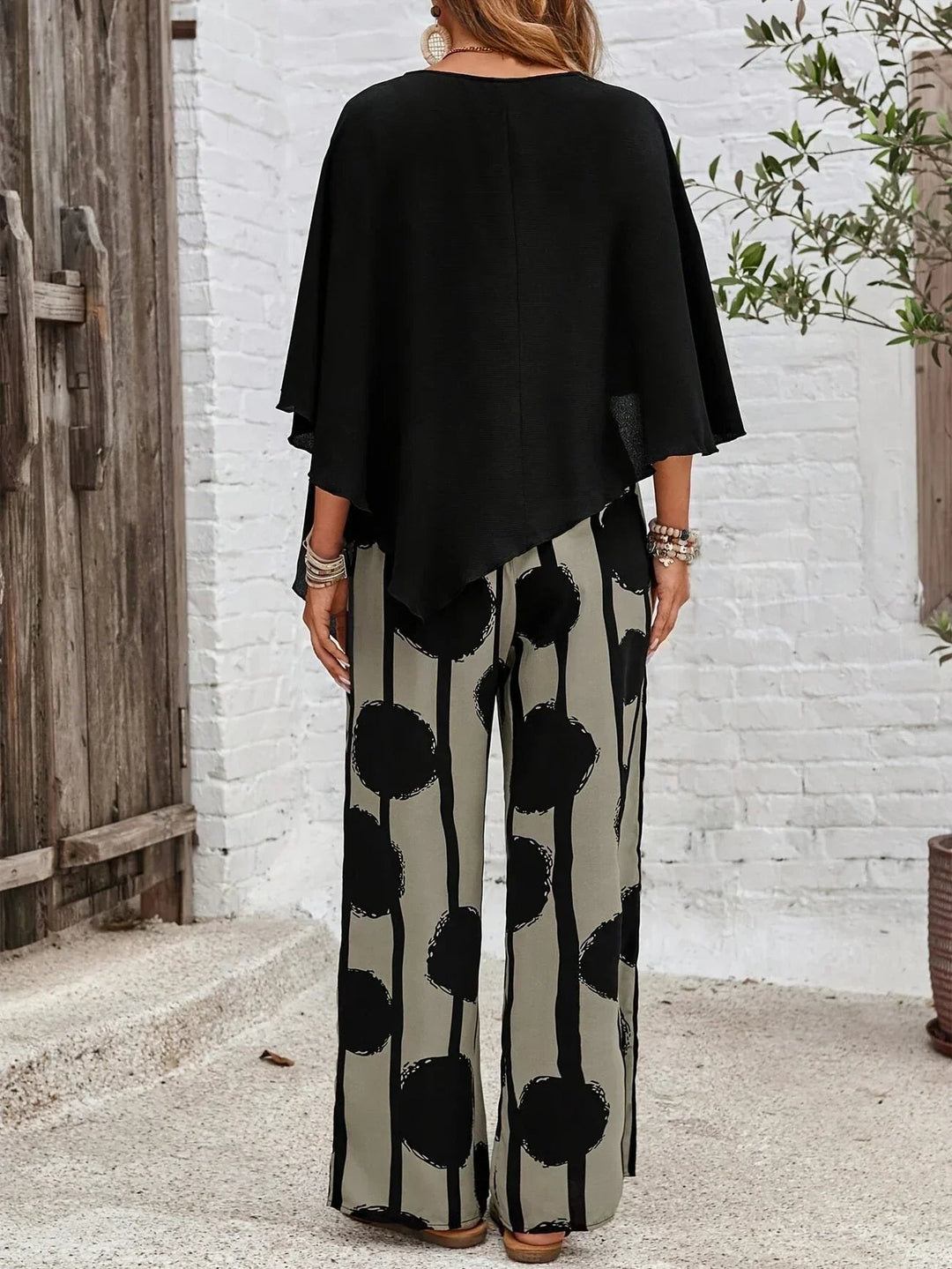 Fashionable women's polyester blend asymmetric long sleeve top and floral printed pants set