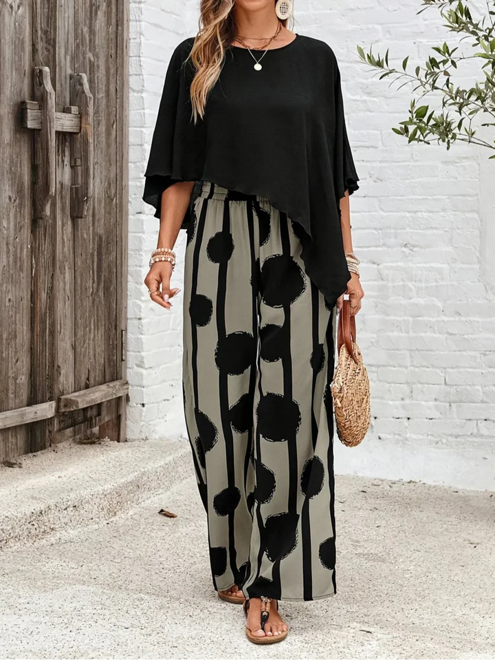 Versatile women's asymmetric top & printed pants combo perfect for casual or semi-formal occasions