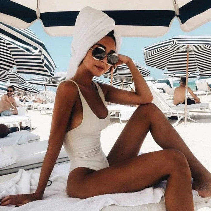 Solid color backless one-piece swimsuit for women. Stylish and elegant beachwear for pool & vacation.