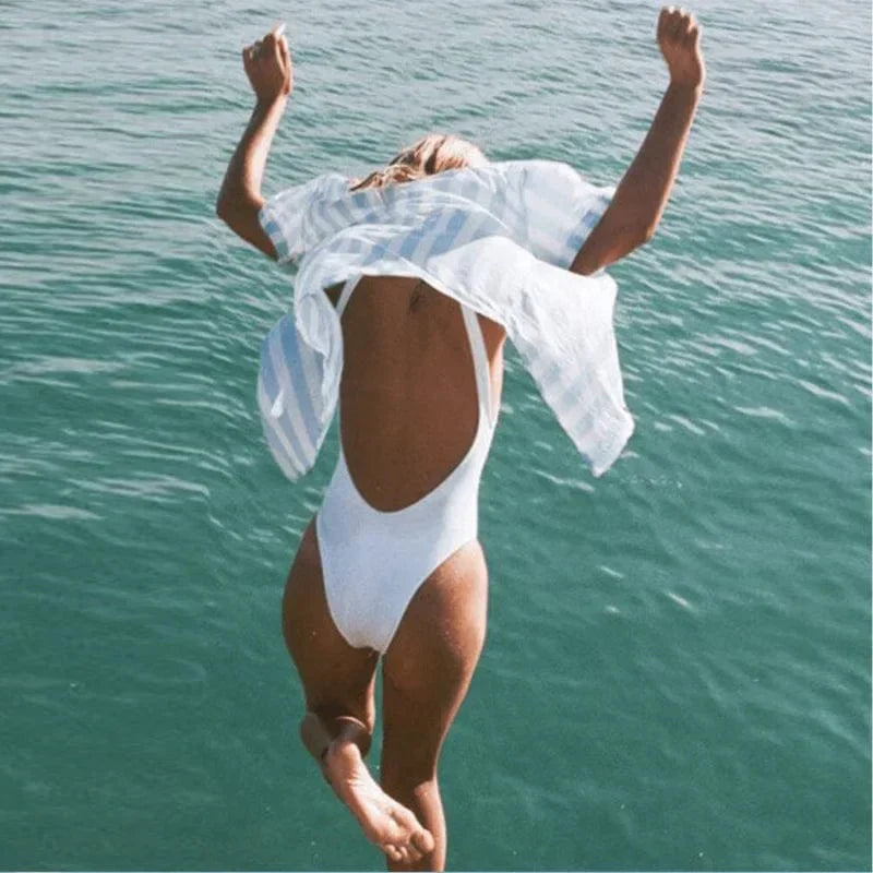 Women's elegant one-piece backless swimsuit. Classic style beachwear, perfect for your next vacation or pool day.