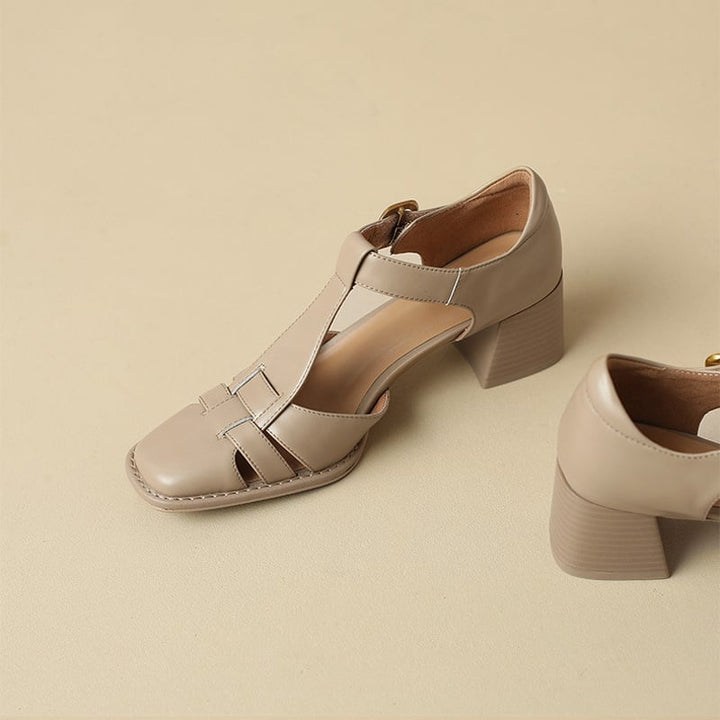 Close-up of a women's square toe T-strap block heel sandal in a neutral tone, highlighting the elegant design.