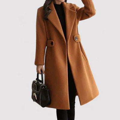 Fashionable women's long belted coat, crafted from a warm wool blend, showcasing classic style.