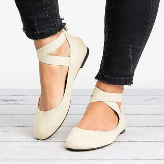 Elegant women's black ballet flats with cross straps, perfect for spring casual wear.