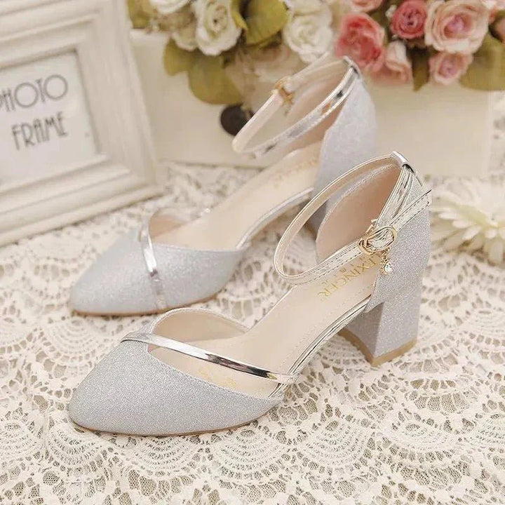 Elegant women's black block heel ankle strap shoes, versatile for formal or casual outfits.