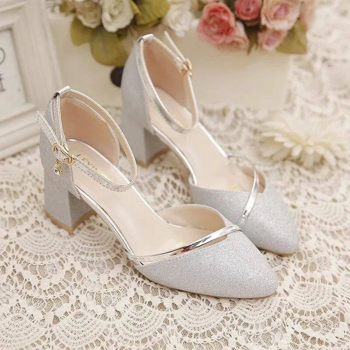 Chic silver block heel ankle strap dress shoes for women, offering comfort and style.