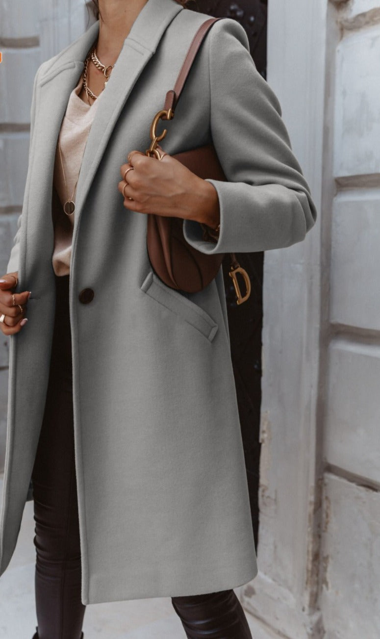 Fashionable women's button-front formal long coat, a key item for elegant business wear.
