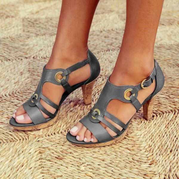 Elegant women's black chunky heeled sandals with open toe, perfect for evening wear or chic daytime style.