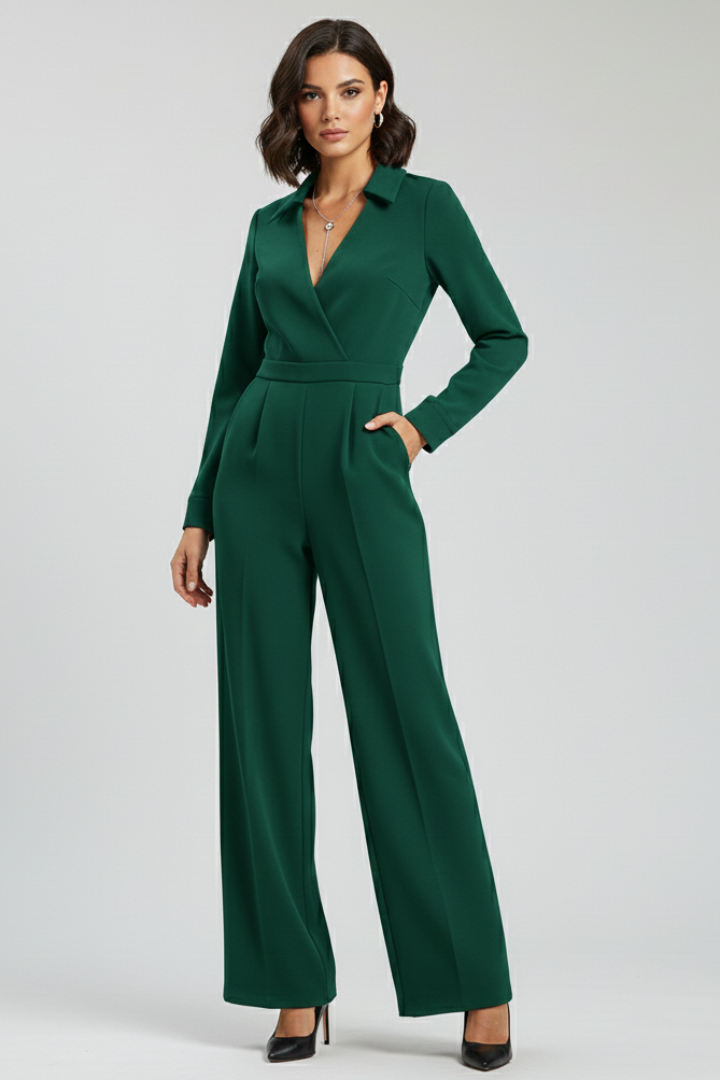Full-length shot of a woman in a elegant green collared wide-leg tailored jumpsuit, standing pose.