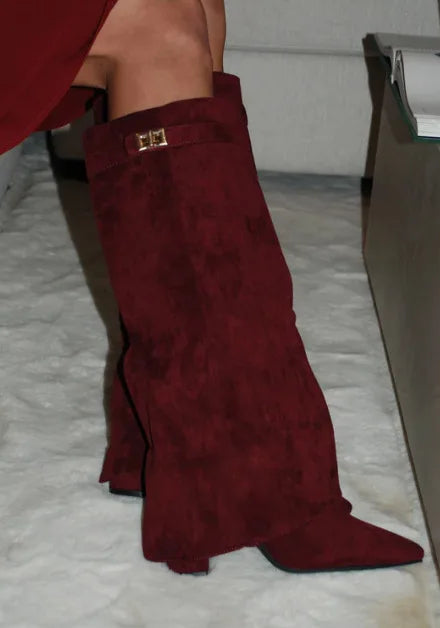 Women's luxurious thigh-high leather boots with subtle buckle detail, a quintessential fall accessory.