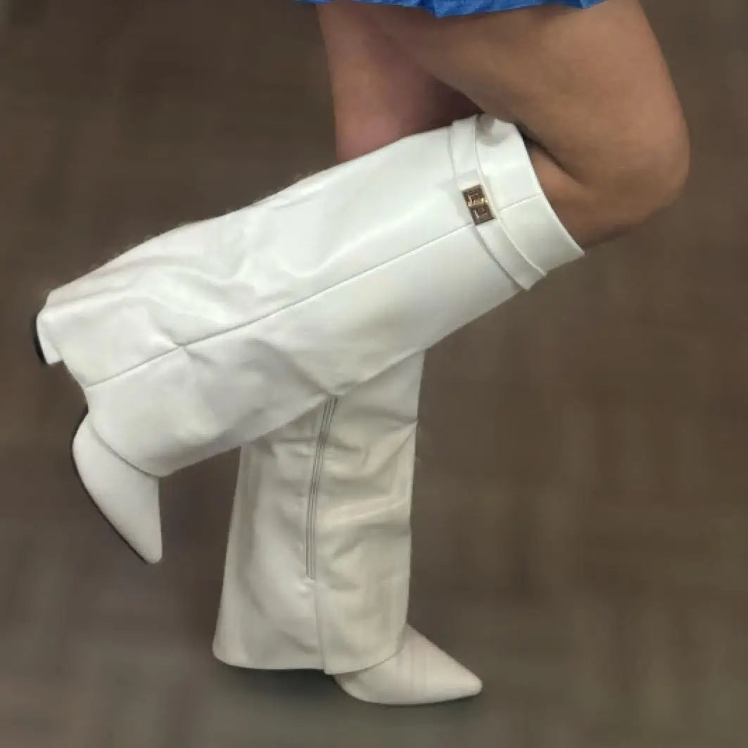 Close-up of the buckle accent on luxurious women's leather thigh-high boots, highlighting quality.