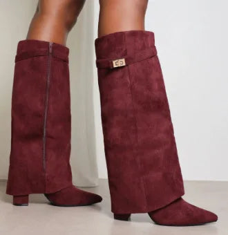 Side profile of women's leather thigh-high boots showcasing the buckle and full shaft length.
