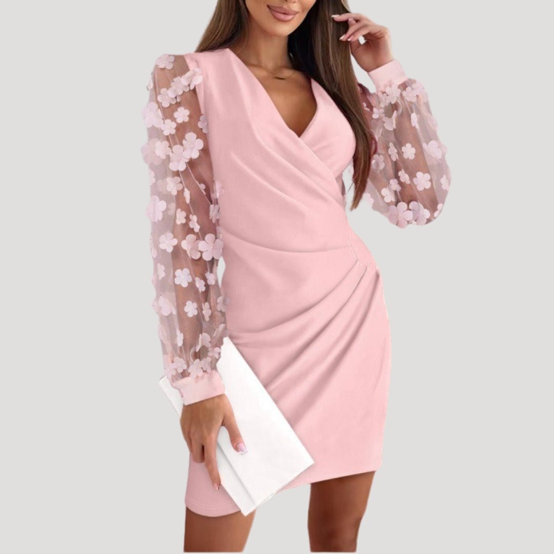 Fashionable women's sheer sleeve mini wrap dress, featuring a flattering V-neck and a sophisticated silhouette.