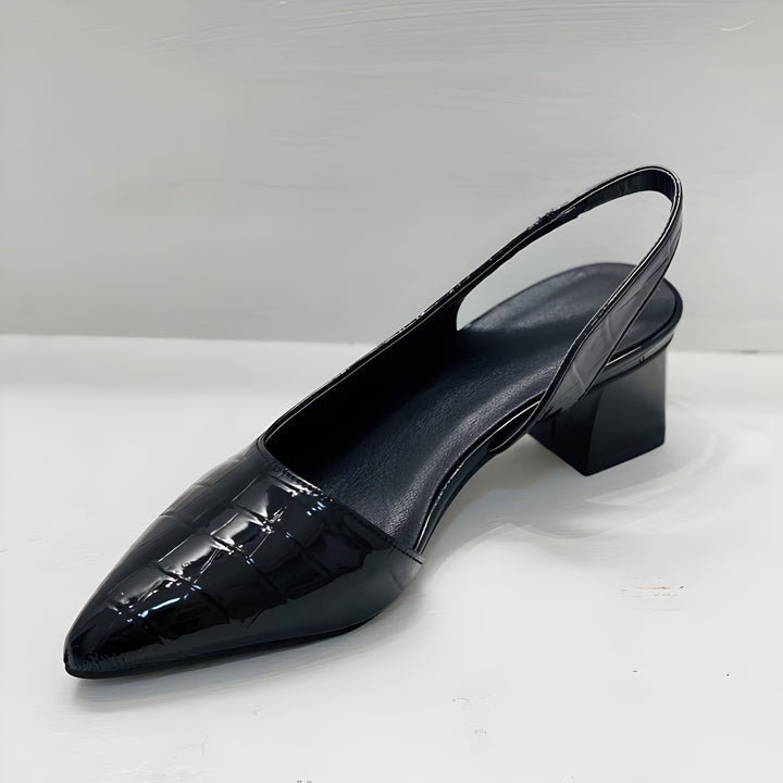 Fashionable women's pointed toe block heel pumps, a key trend in summer shoes for versatile styling.