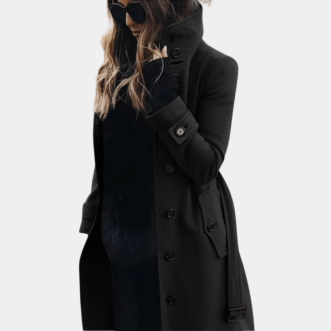 Front view of ladies' black quilted long coat featuring a fashionable adjustable belt