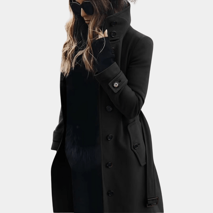 Front view of ladies' black quilted long coat featuring a fashionable adjustable belt