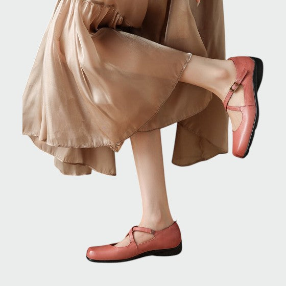 Side view of women's square-toe Mary Jane shoes, highlighting cross-straps and block heel