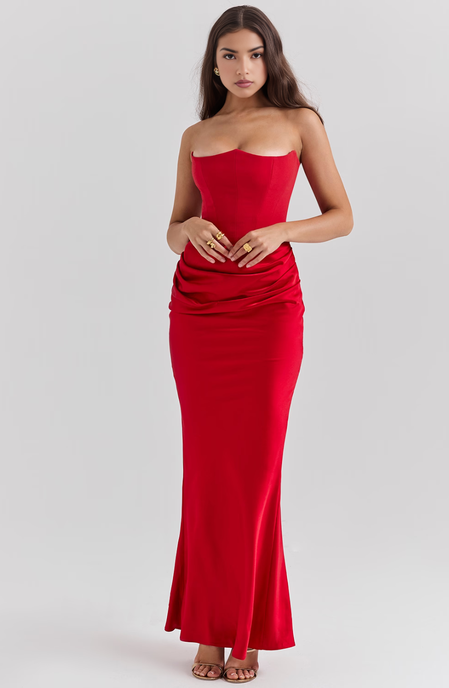 Flattering red strapless bodycon maxi dress with corset detailing, perfect for women's parties.
