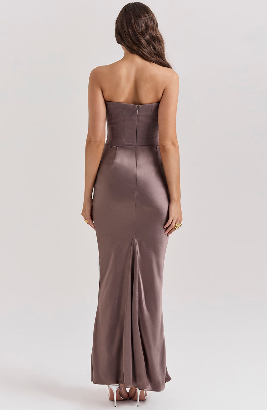 Close-up of the corset detail on a black strapless bodycon maxi dress, women's fashion.