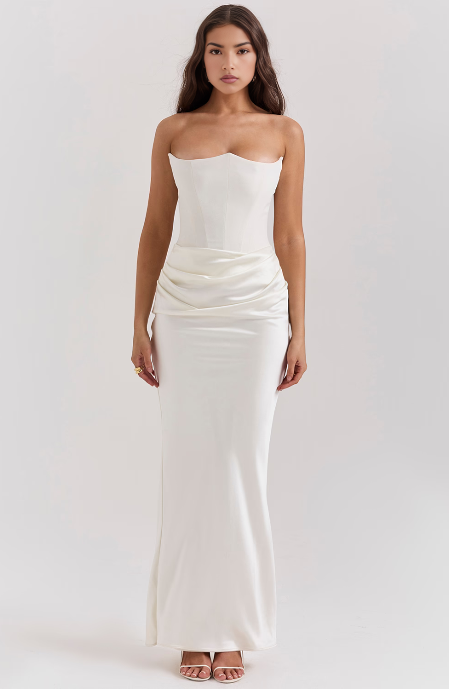 Front view of a white strapless bodycon maxi dress with corset, sophisticated women's formal wear.
