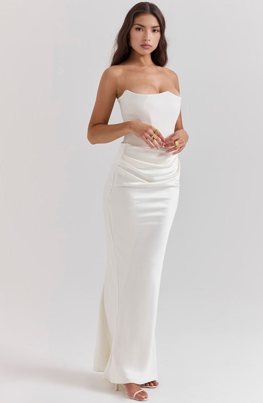 A collection of strapless corset bodycon maxi dresses in black, red, white, and brown for women.