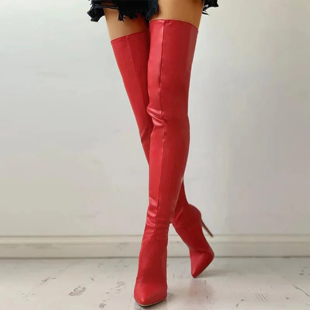 Elegant women's black thigh-high over-the-knee boots with a sharp pointed toe and a stylish high heel.