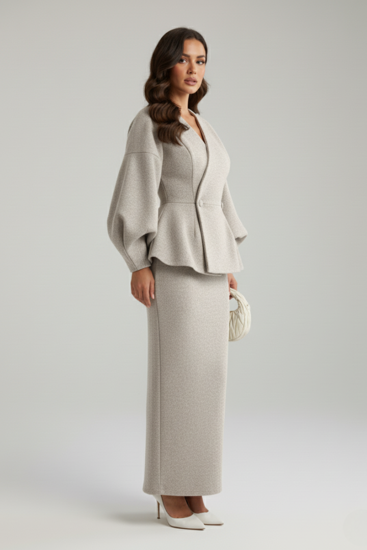 Professional women's apparel: a stylish V-neck blazer and coordinated skirt set for office or events.
