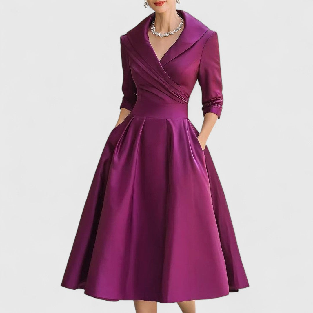 Beige women's classic V-neck midi dress, offering an elegant look with 3/4 sleeves and a full flared skirt.