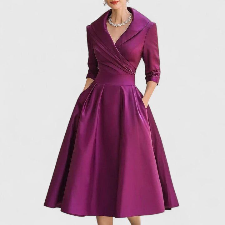 Beige women's classic V-neck midi dress, offering an elegant look with 3/4 sleeves and a full flared skirt.