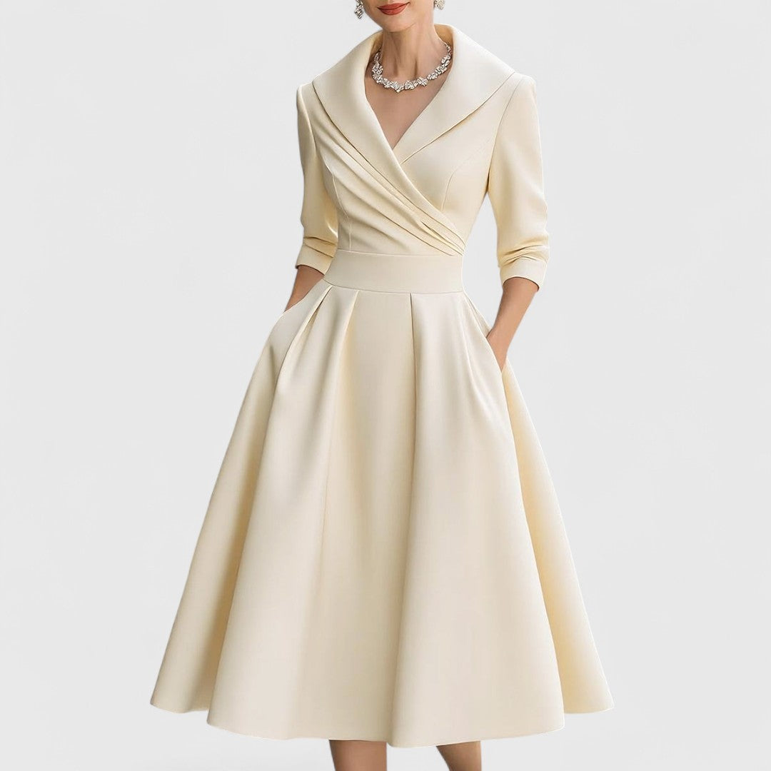 Purple women's V-neck midi dress, a comfortable and stylish option with 3/4 sleeves and a graceful flared skirt.