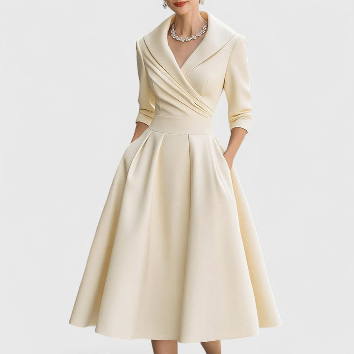 Purple women's V-neck midi dress, a comfortable and stylish option with 3/4 sleeves and a graceful flared skirt.